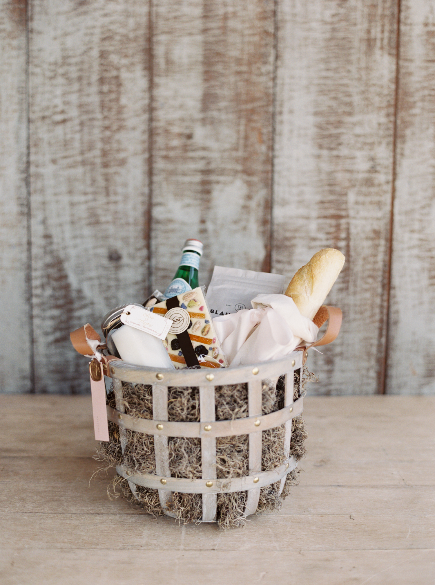 Pippin Hill Wedding Photos | Molly Carr Photography | Lauren Emerson Events | Pippin Hill Farm & Vineyard | Luxury Wedding Gift Basket with Baguette, Candle, Chocolate, and Water