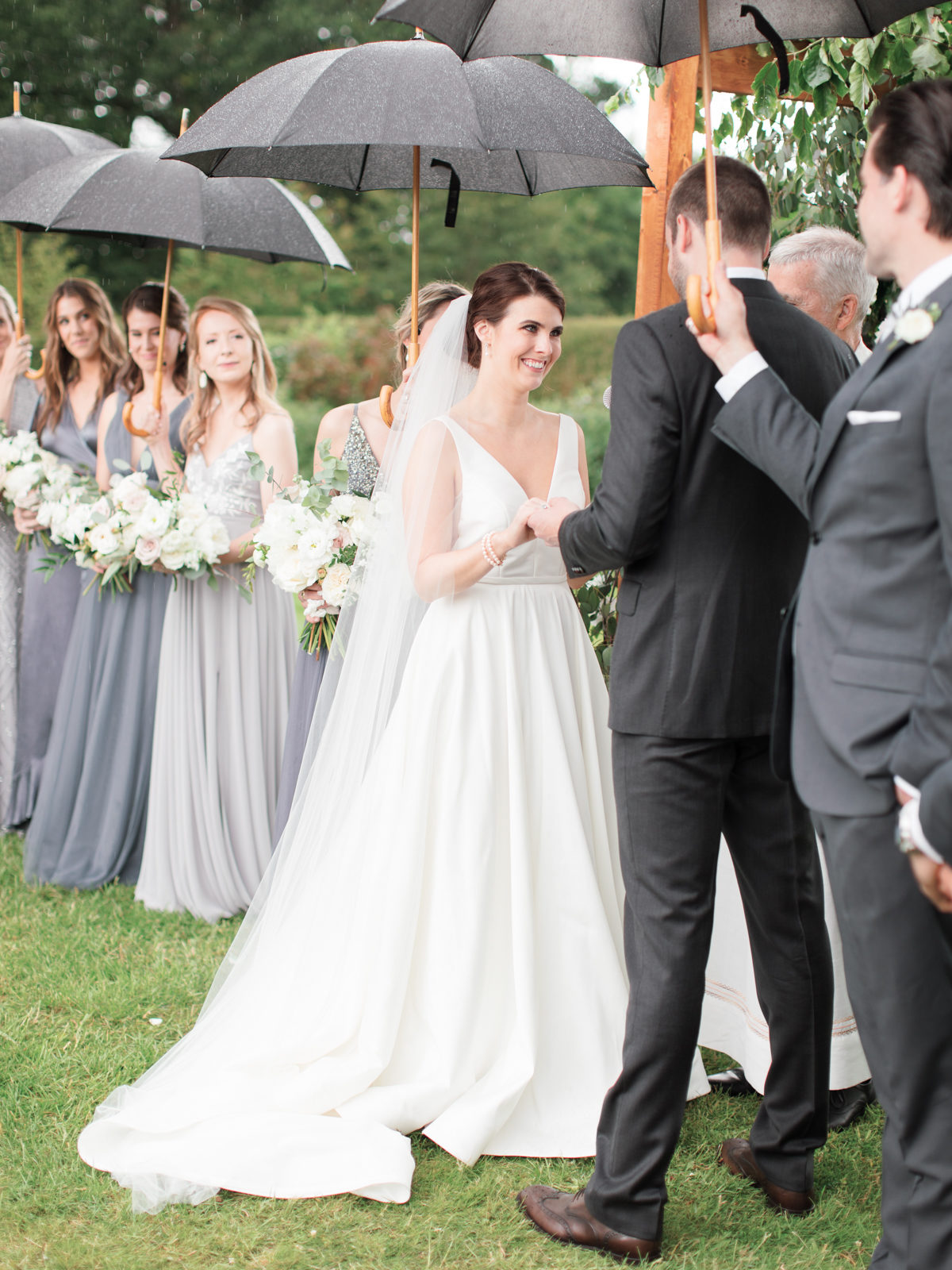 Ireland Film Photographer | Molly Carr Photography | Bride and Groom Under Black Umbrellas During Mount Juliet Estate Wedding Ceremony