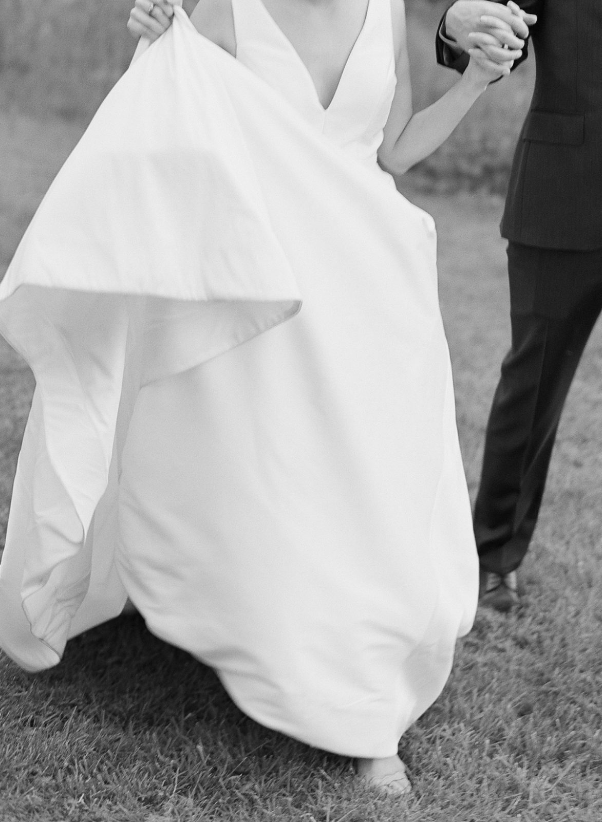 Ireland Film Photographer | Molly Carr Photography | Black and White Photo of Bride in White Jenny Yoo Wedding Dress and Groom Walking
