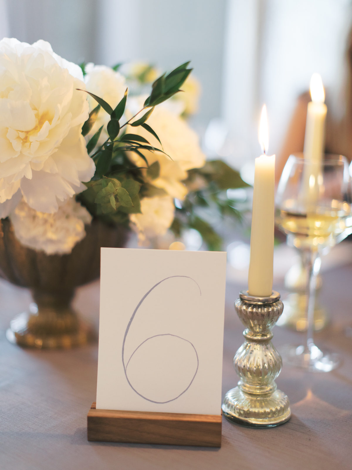 Ireland Film Photographer | Molly Carr Photography | Romantic Wedding Reception Decor with Calligraphy Table Number and White Roses by Candlelight